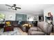 Inviting living room featuring comfortable leather seating, stylish decor, and an open layout for easy entertaining at 4793 Grassy Knoll Dr, Tavares, FL 32778