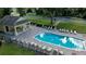 Community pool with brick pavers and abundant lounge chairs in the fenced pool area at 4793 Grassy Knoll Dr, Tavares, FL 32778