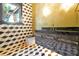 Sleek bathroom featuring bold geometric tiles, a floating vanity, and contemporary fixtures, creating a modern design at 5525 Isleworth Country Club Dr, Windermere, FL 34786