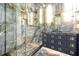 Luxury bathroom featuring a glass enclosed shower and vanity with stone countertops and storage drawers at 5525 Isleworth Country Club Dr, Windermere, FL 34786