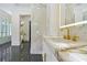 Stylish bathroom featuring marble walls and countertops and modern fixtures at 5525 Isleworth Country Club Dr, Windermere, FL 34786