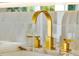 Close-up of a modern faucet on a marble countertop in a luxurious bathroom at 5525 Isleworth Country Club Dr, Windermere, FL 34786