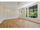 Bright bedroom with large windows, ceiling fan, and decorative wallpaper for a stylish aesthetic at 5525 Isleworth Country Club Dr, Windermere, FL 34786