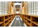 Spacious walk-in closet with custom wooden shelving and tiled floor at 5525 Isleworth Country Club Dr, Windermere, FL 34786