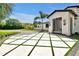 Elegant entry with a geometrically designed driveway and mature landscaping leading to the stylish home at 5525 Isleworth Country Club Dr, Windermere, FL 34786