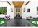 Elegant front entrance with custom sidelights and lush landscaping at 5525 Isleworth Country Club Dr, Windermere, FL 34786