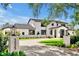 Stunning modern home showcasing detailed landscaping, custom pavers, and sleek exterior accents, perfect curb appeal at 5525 Isleworth Country Club Dr, Windermere, FL 34786