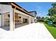Stunning view of the exterior with an outdoor kitchen, and a water feature in the backyard at 5525 Isleworth Country Club Dr, Windermere, FL 34786