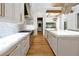 Chef's kitchen showcasing marble counters, custom cabinets and high-end appliances at 5525 Isleworth Country Club Dr, Windermere, FL 34786