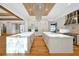 Open concept kitchen with double marble islands, custom cabinets, and luxury fixtures at 5525 Isleworth Country Club Dr, Windermere, FL 34786