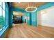 Bright living area with custom millwork, tray ceiling, wood floors, and upscale finishes offering modern elegance at 5525 Isleworth Country Club Dr, Windermere, FL 34786
