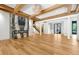 Spacious living room features hardwood floors, a modern fireplace and eye-catching chandelier at 5525 Isleworth Country Club Dr, Windermere, FL 34786