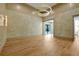Expansive living room with hardwood floors, decorative chandelier, and beautiful neutral wall tones at 5525 Isleworth Country Club Dr, Windermere, FL 34786