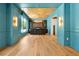 Spacious living area with detailed millwork, tray ceiling, wood floors, and upscale finishes offering modern elegance at 5525 Isleworth Country Club Dr, Windermere, FL 34786