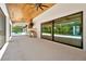 Outdoor patio featuring a summer kitchen, ceiling fans and beautiful views at 5525 Isleworth Country Club Dr, Windermere, FL 34786