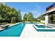 Relaxing pool and spa area surrounded by lush landscaping, creating a private oasis at 5525 Isleworth Country Club Dr, Windermere, FL 34786