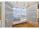 Interior of large refrigerator with white and silver shelving at 5525 Isleworth Country Club Dr, Windermere, FL 34786