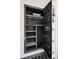 Interior view of large open Hollon safe with shelves and pouches at 5525 Isleworth Country Club Dr, Windermere, FL 34786