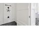 Intriguing safe room features a secure steel door with combination lock and black tile flooring at 5525 Isleworth Country Club Dr, Windermere, FL 34786
