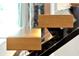 Modern glass staircase with wood treads and metal supports at 5525 Isleworth Country Club Dr, Windermere, FL 34786