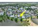 This aerial view shows the home's position on a lake within a quiet residential neighborhood at 633 Lakehaven Cir, Orlando, FL 32828