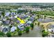 This aerial view highlights the home's location on a lake in a beautiful, established community at 633 Lakehaven Cir, Orlando, FL 32828
