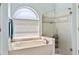 Beautiful bathroom features a soaking tub and glass enclosed shower at 633 Lakehaven Cir, Orlando, FL 32828