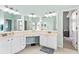 Spacious bathroom featuring double sinks, vanity with ample storage, and neutral tiled floors at 633 Lakehaven Cir, Orlando, FL 32828