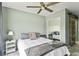 Cozy bedroom with ceiling fan and light green walls offers comfortable retreat at 633 Lakehaven Cir, Orlando, FL 32828