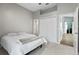 Bedroom features neutral colors, a ceiling fan, closet, and entryways to other rooms at 633 Lakehaven Cir, Orlando, FL 32828