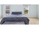 Bright bedroom with a queen bed and windows offering natural light and views at 633 Lakehaven Cir, Orlando, FL 32828