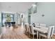 Open dining and living space filled with natural light and wood flooring at 633 Lakehaven Cir, Orlando, FL 32828