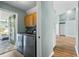 The laundry room includes washer and dryer with light blue wall and wood floors at 633 Lakehaven Cir, Orlando, FL 32828