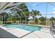 Relaxing screened pool area with spa and tranquil lake views for the perfect private backyard at 633 Lakehaven Cir, Orlando, FL 32828