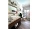 Stylish bathroom featuring a walk-in shower, modern fixtures, and a spacious vanity at 6350 Sedona Leaf Ct, Windermere, FL 34786