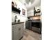 Well-organized laundry room equipped with modern appliances, built-in cabinets, and ample counter space at 6350 Sedona Leaf Ct, Windermere, FL 34786