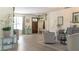 Bright living room with hardwood floors, neutral furniture, and elegant decor accents at 6350 Sedona Leaf Ct, Windermere, FL 34786