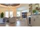 Open living space with fireplace, French doors, and wet bar with wine storage at 6350 Sedona Leaf Ct, Windermere, FL 34786