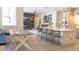 Open-concept featuring a dining nook, kitchen island, and comfortable living area with a fireplace at 6350 Sedona Leaf Ct, Windermere, FL 34786