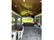 Expansive outdoor kitchen and dining area with ceiling fans, offering a perfect space for outdoor gatherings at 6350 Sedona Leaf Ct, Windermere, FL 34786