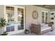 Covered porch has a bed swing, offering a relaxing view of the pool and backyard at 6350 Sedona Leaf Ct, Windermere, FL 34786