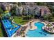 Resort-style community with a pool, water slides, and lush landscaping, offering a luxurious living experience at 7650 Comrow St # 403, Kissimmee, FL 34747