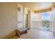 Condo balcony with a peaceful bench overlooking serene surroundings, creating a perfect outdoor relaxation spot at 7650 Comrow St # 403, Kissimmee, FL 34747
