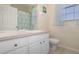 Bright bathroom with vanity, large mirror, and a shower/tub, offers a practical space at 7650 Comrow St # 403, Kissimmee, FL 34747
