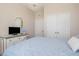 Comfortable bedroom featuring a chandelier, dresser, and closet space, and a comfortable bed at 7650 Comrow St # 403, Kissimmee, FL 34747