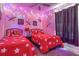 Colorful bedroom with string lights, themed decor, twin beds and a playful atmosphere at 7650 Comrow St # 403, Kissimmee, FL 34747