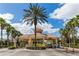 Entrance to community showing palm trees and guard station at 7650 Comrow St # 403, Kissimmee, FL 34747