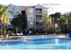 Building exterior shows pool in foreground with balcony in the upper-right corner at 7650 Comrow St # 403, Kissimmee, FL 34747