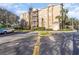 Exterior view showing building facade with car parked in the foreground at 7650 Comrow St # 403, Kissimmee, FL 34747