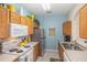 Functional kitchen featuring a full suite of appliances and ample counter space perfect for cooking at 7650 Comrow St # 403, Kissimmee, FL 34747
